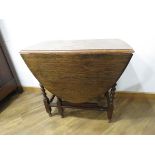 Oak drop leaf table on barley twist supports