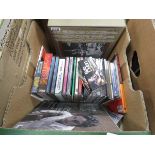 2 boxes containing CDs and vinyl records