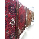 (5) Woolen Iranian rug with central medallion and red background