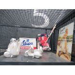 Cage containing reproduction advertising signs, ornamental scooter and a napkin holder