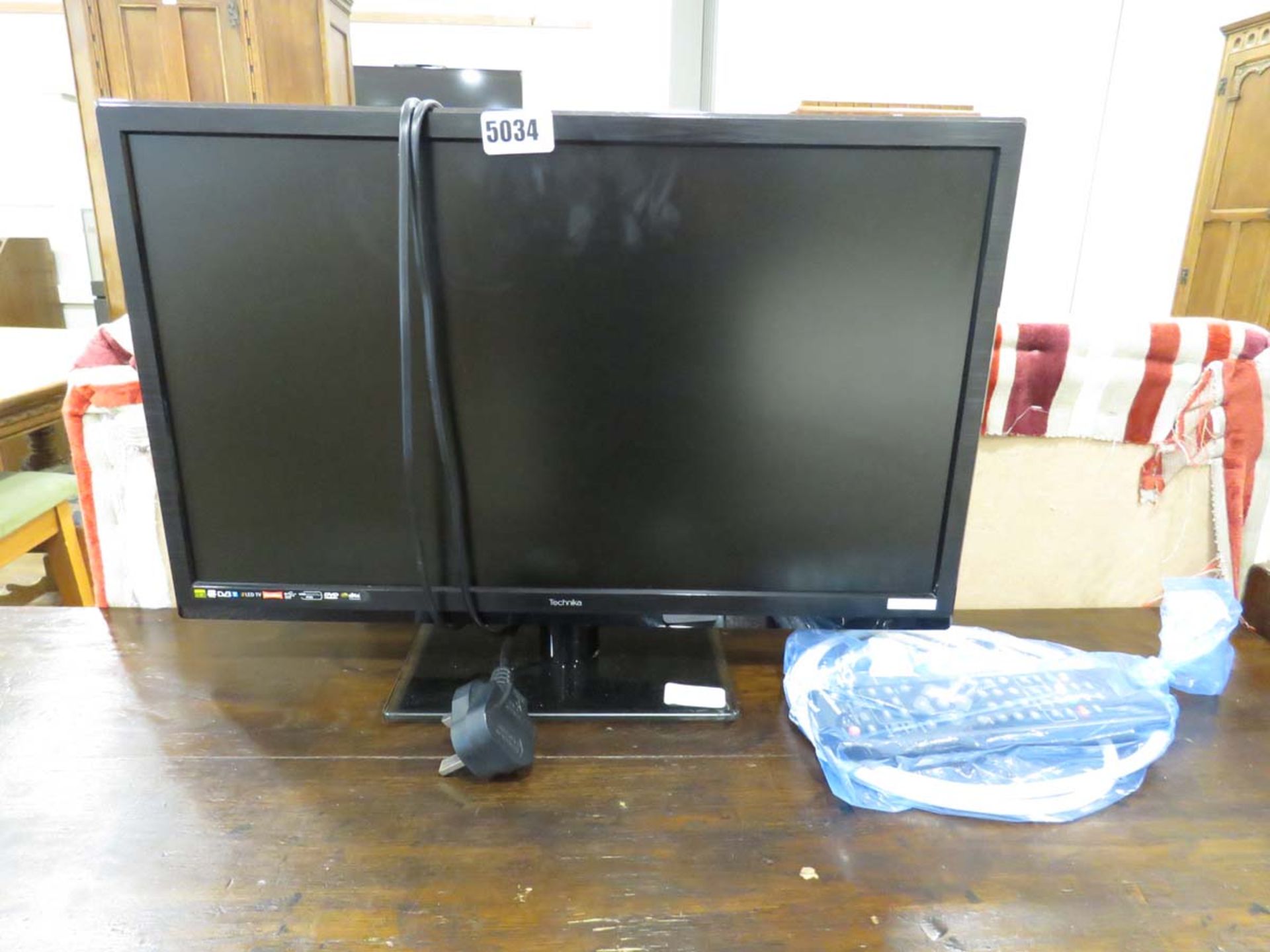 Small Technica flat screen TV with remote