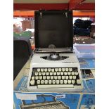 Vintage travelling typewriter and a boxes Rosedale organ