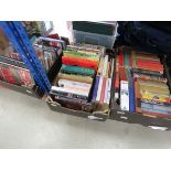 Three boxes containing a quantity of novels and reference books