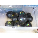 Box containing lawn bowls