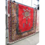 (3) Woolen Moroccan carpet with central medallion and red background