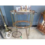 Oval two tier tea trolley with glass inserts and brass support