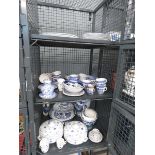 3 cages containing blue and white and onion patterned crockery