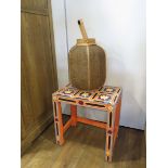 Decorated small occasional table and a wicker lantern