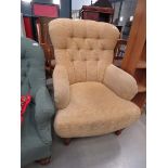 Brown fabric button back armchair