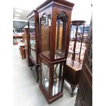 A glazed double door china cabinet