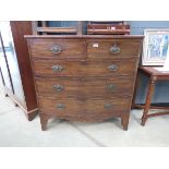 A Victorian bow fronted chest of 2 over 3 drawers