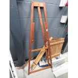 Two folding artists easels plus shelves