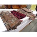3 multi colour kilims and a red a black woolen mat