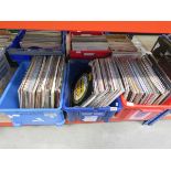 Three boxes containing vinyl records