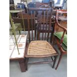 Wicker seated wheel back chair