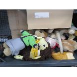 Cage containing meerkat and other fluffy toys