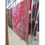 (1) Woolen Afghan carpet with floral pattern with red background and central medallion