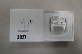 Apple AirPods with charging case in box