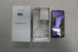 Huawei P30 Lite mobile phone with charger and box
