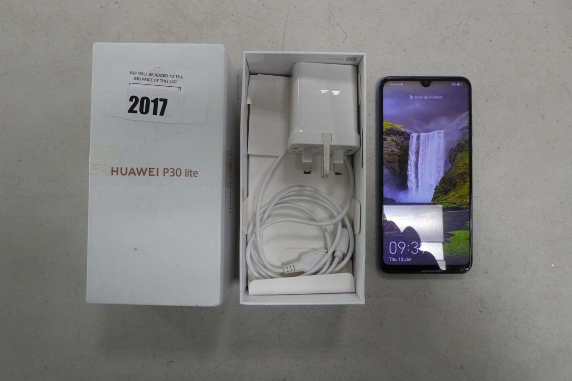 Huawei P30 Lite mobile phone with charger and box