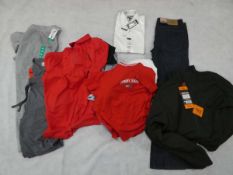 Selection of men's clothing to include Tommy Hilfiger, Fila, Kirkland, 32 Degree Heat, Under Armour,