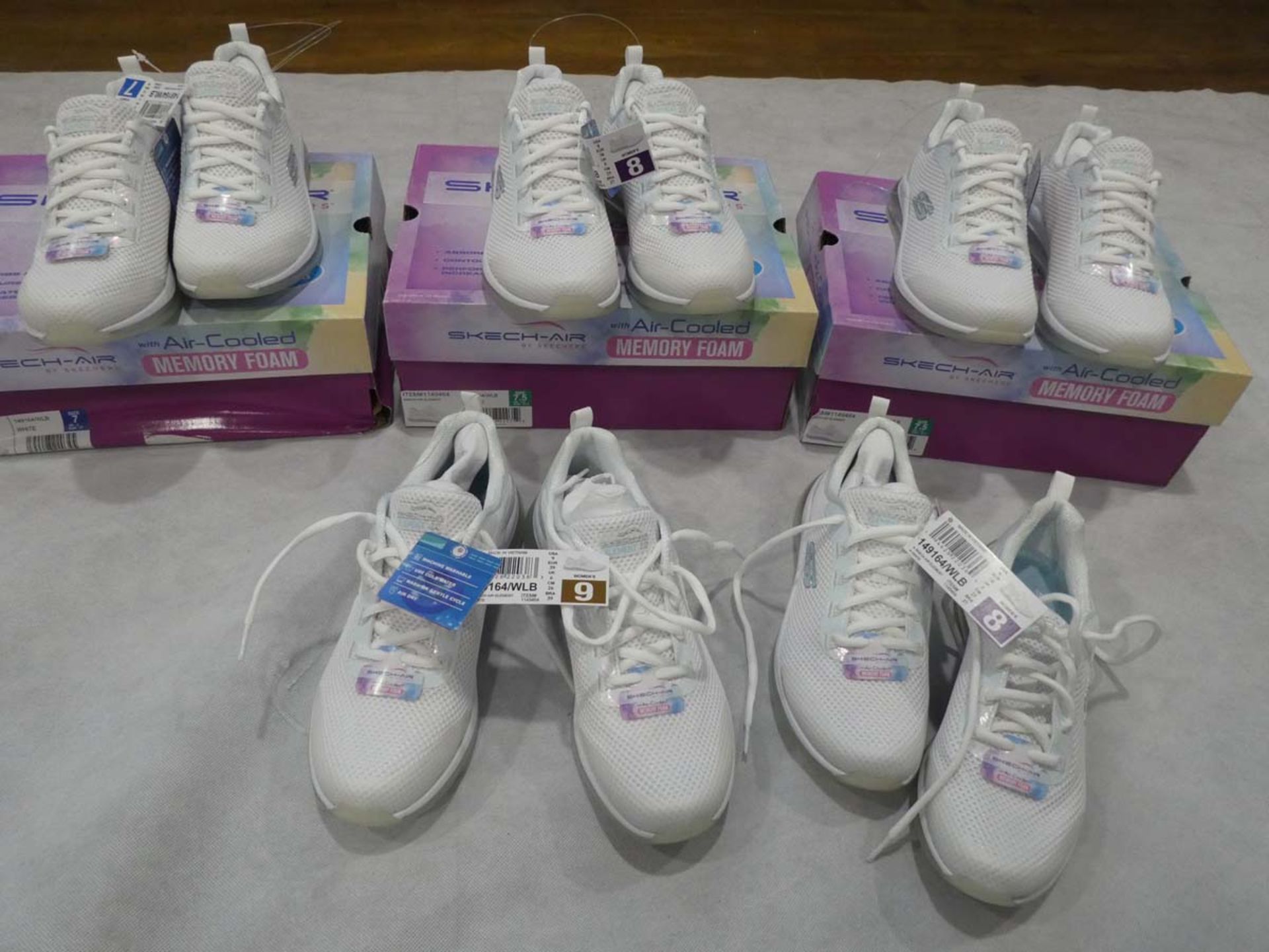 5 Boxed pairs of sketchers air cooled memory foam white trainer shoes in various sizes