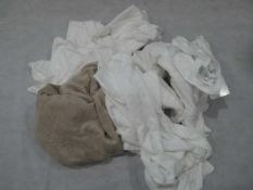 Selection of various luxury towels in white and light brown