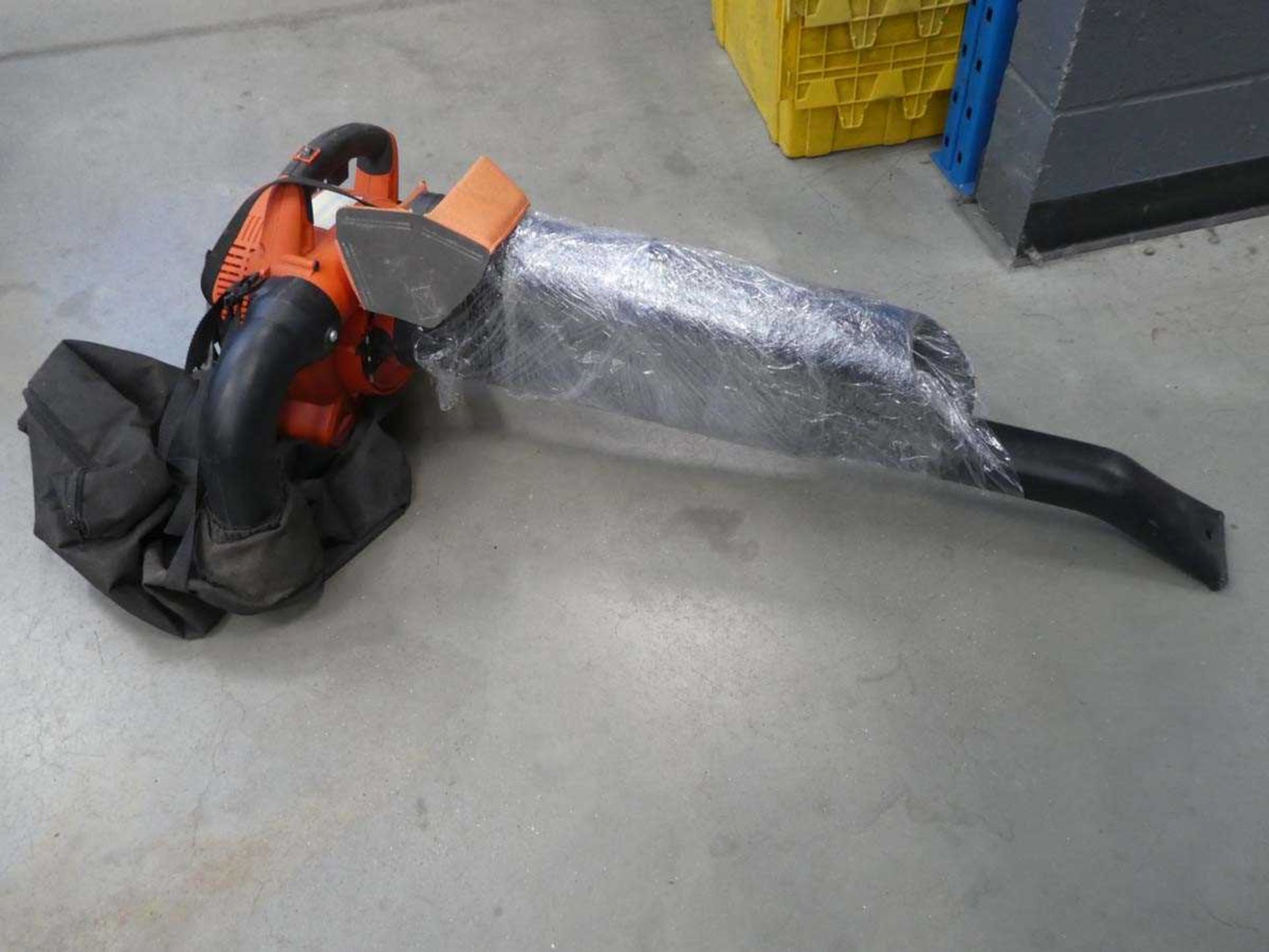 Orange petrol powered leaf blower