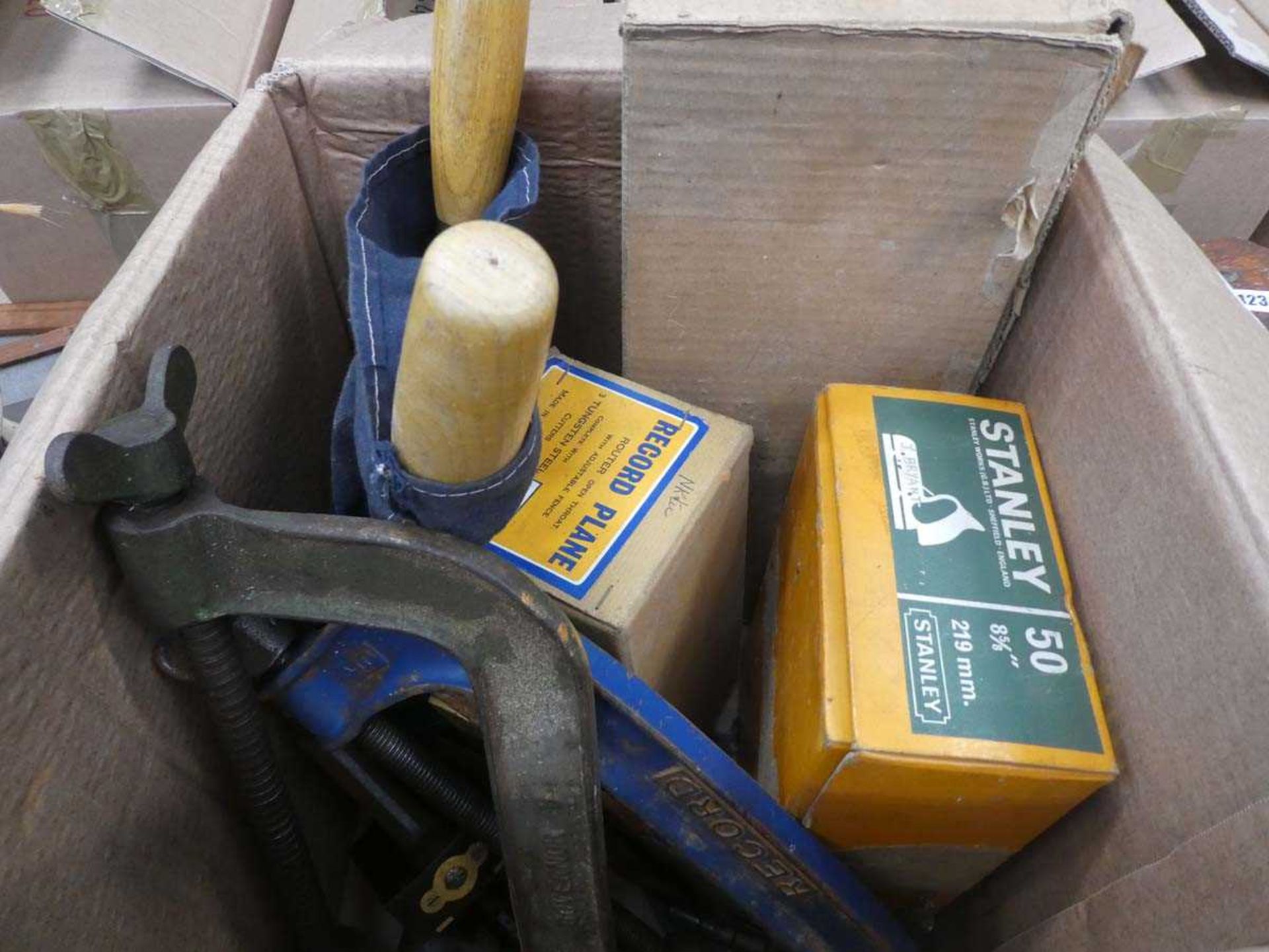 Box containing G-clamps, planes, chisels and various other tools