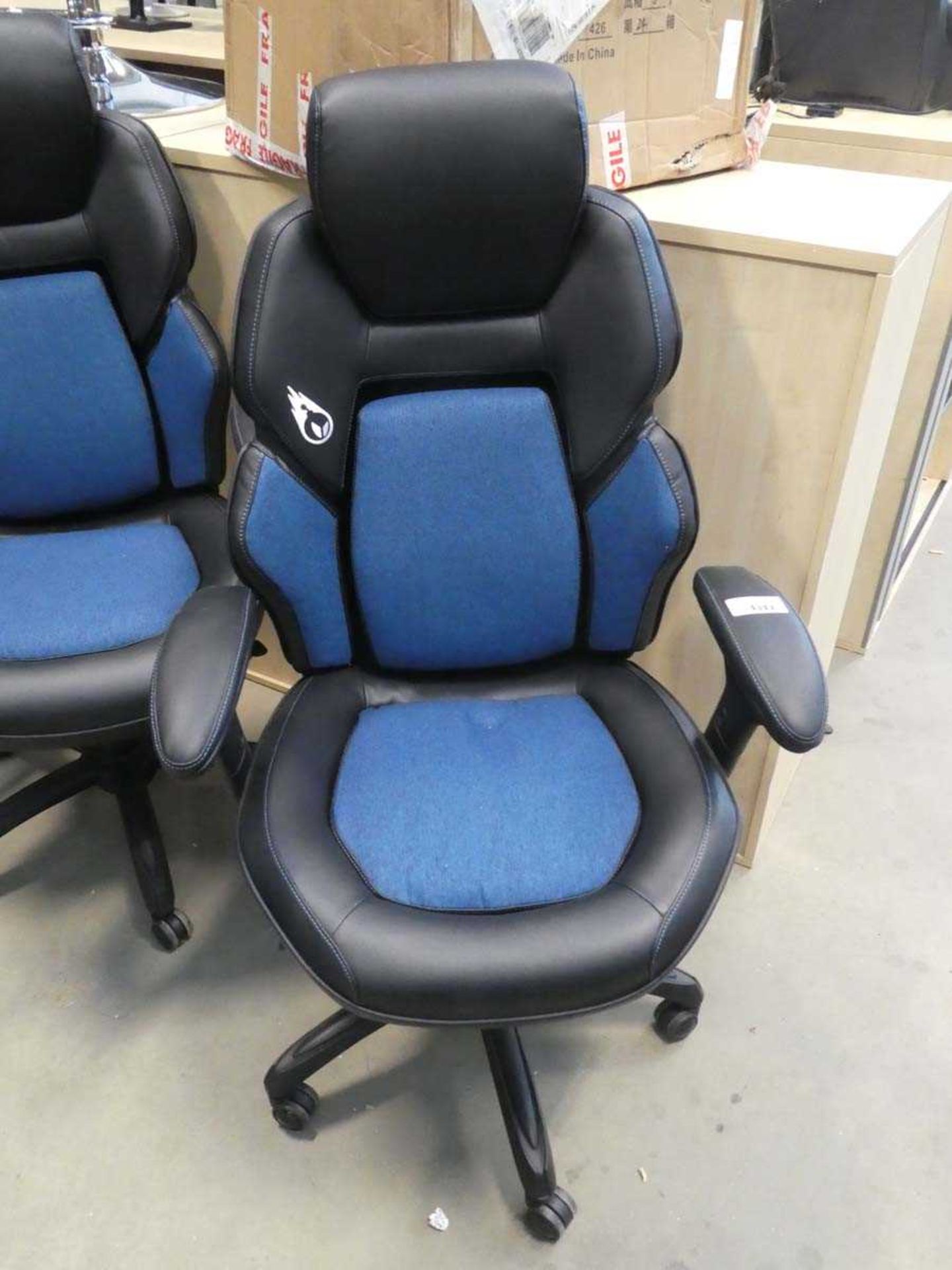 +VAT Black and blue cloth high back swivel armchair