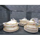 Cage containing floral patterned Staffordshire dinner and side plates plus tureens and ladles