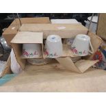 2 boxes containing kitchenware, tea and coffee cups and saucers