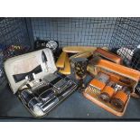 Cage containing gentlemen's grooming kits plus brushes