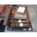 Two boxes containing Imperial dictionaries, Bible, several volumes of the Punch Library of Humour