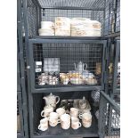 2 cages containing a quantity of Summer Glory Poole pottery crockery and loose cutlery