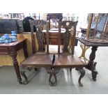 Pair of carved oak hall chairs