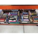 4 boxes containing reference books and novels