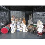 Cage containing paperweight, dancing figures, candlesticks, nodding figure plus centrepiece and