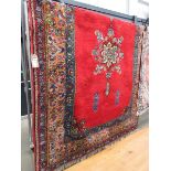 (3) Moroccan woolen carpet with red background and central medallion