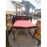 Carved nursing chair with upholstered seat