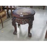 Heavily carved side table with marble insert