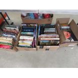 4 boxes containing novels and reference books