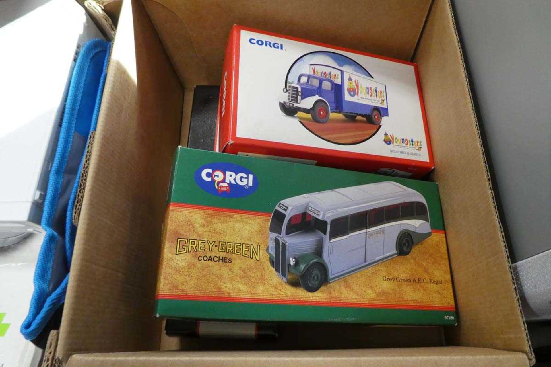 3 boxed Corgi collectible vehicles incl. green coaches, AEC Regal