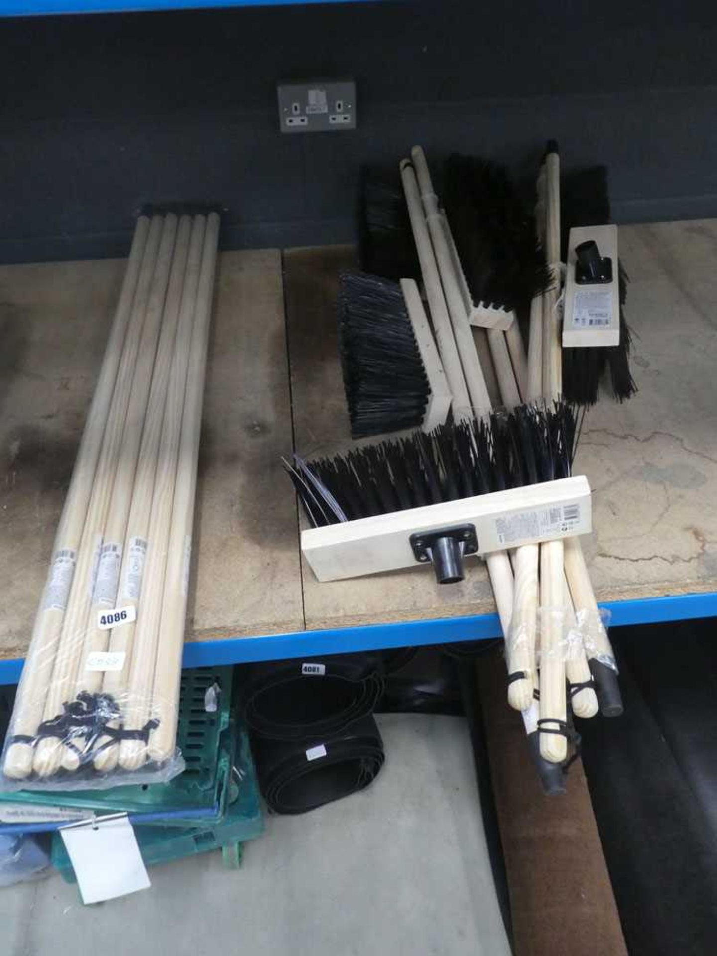 5 assorted brooms and quantity of broom handles