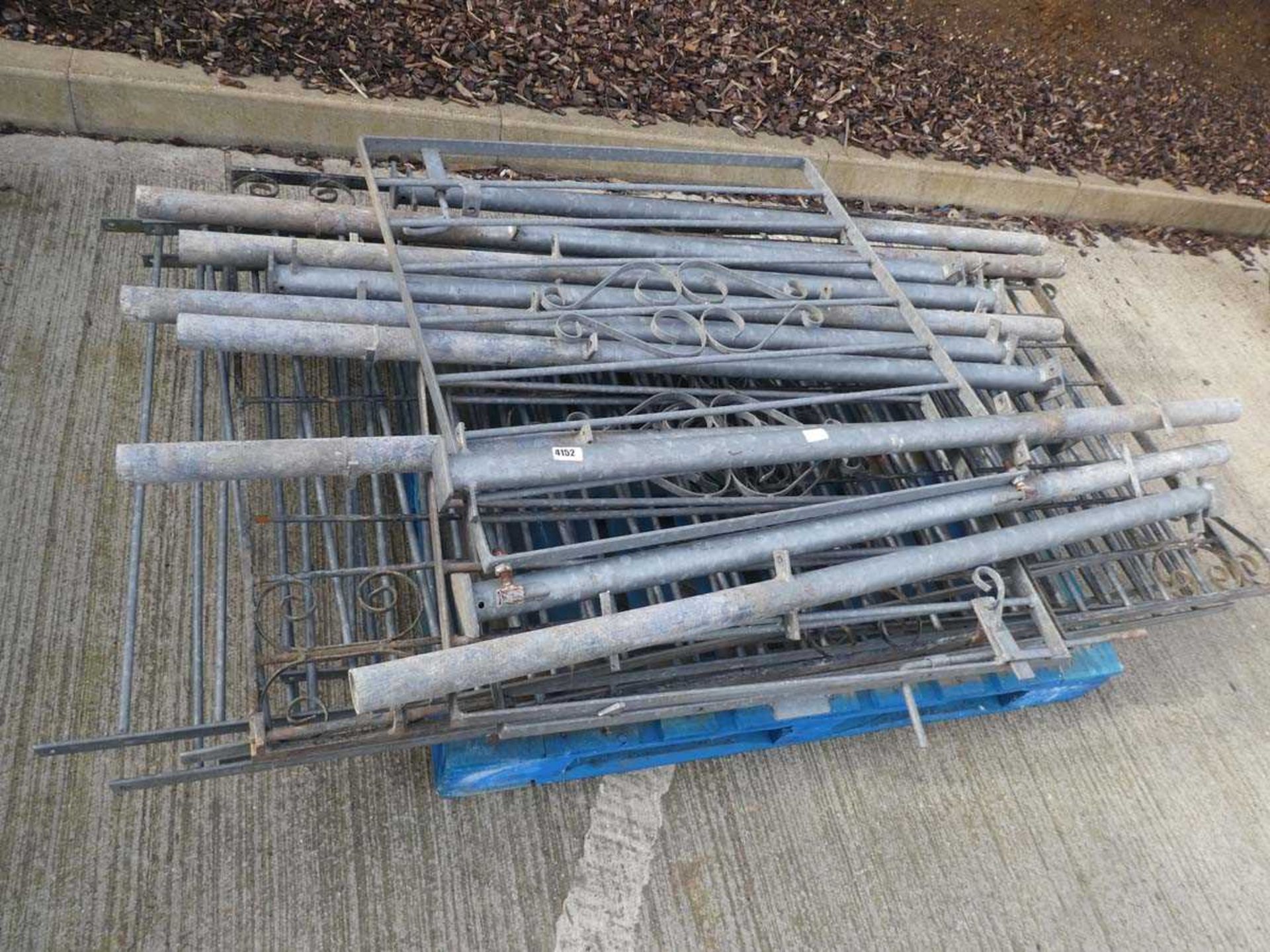 Pallet containing galvanized gates and posts