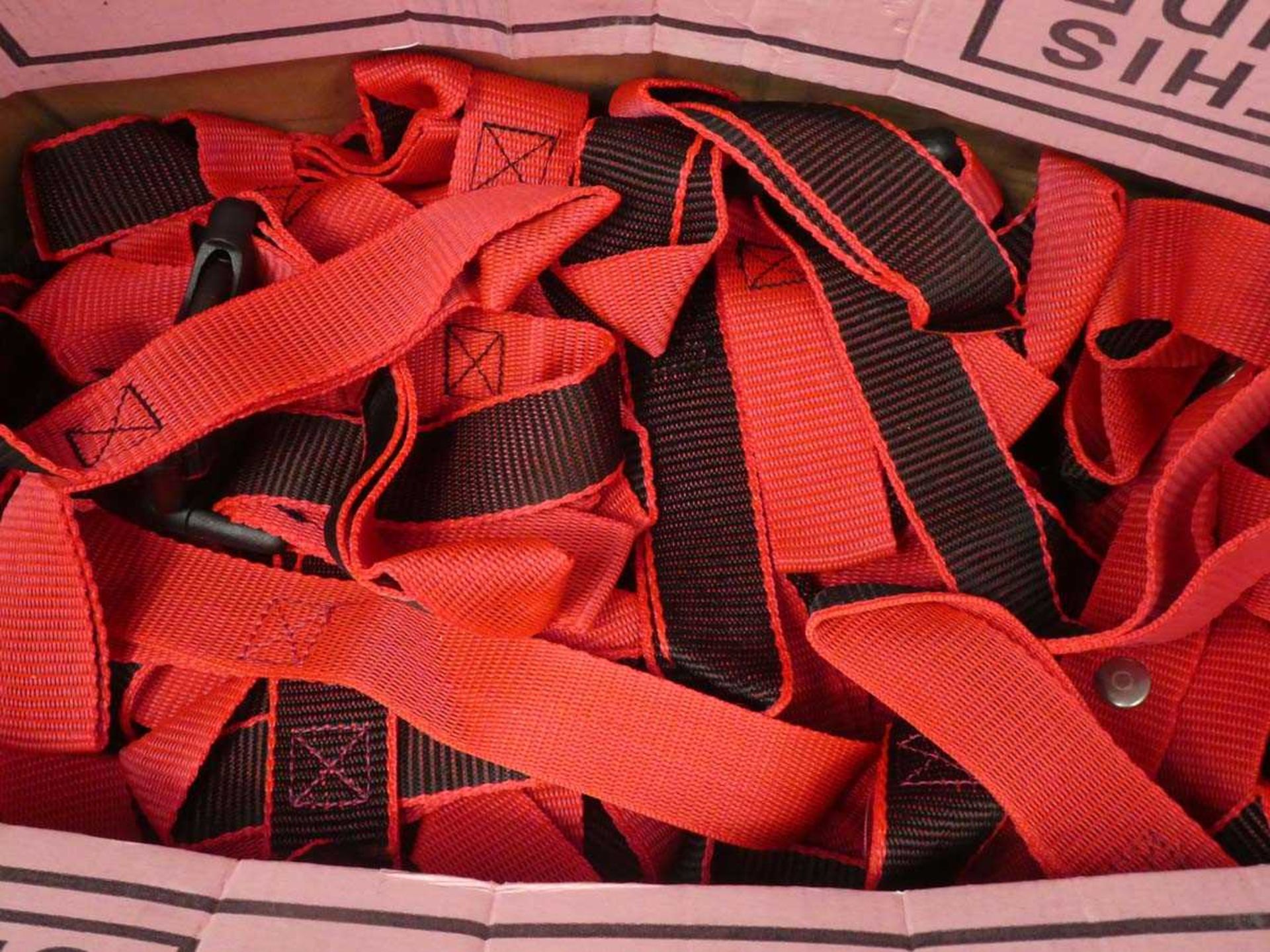 Box of small red straps and box of England flags