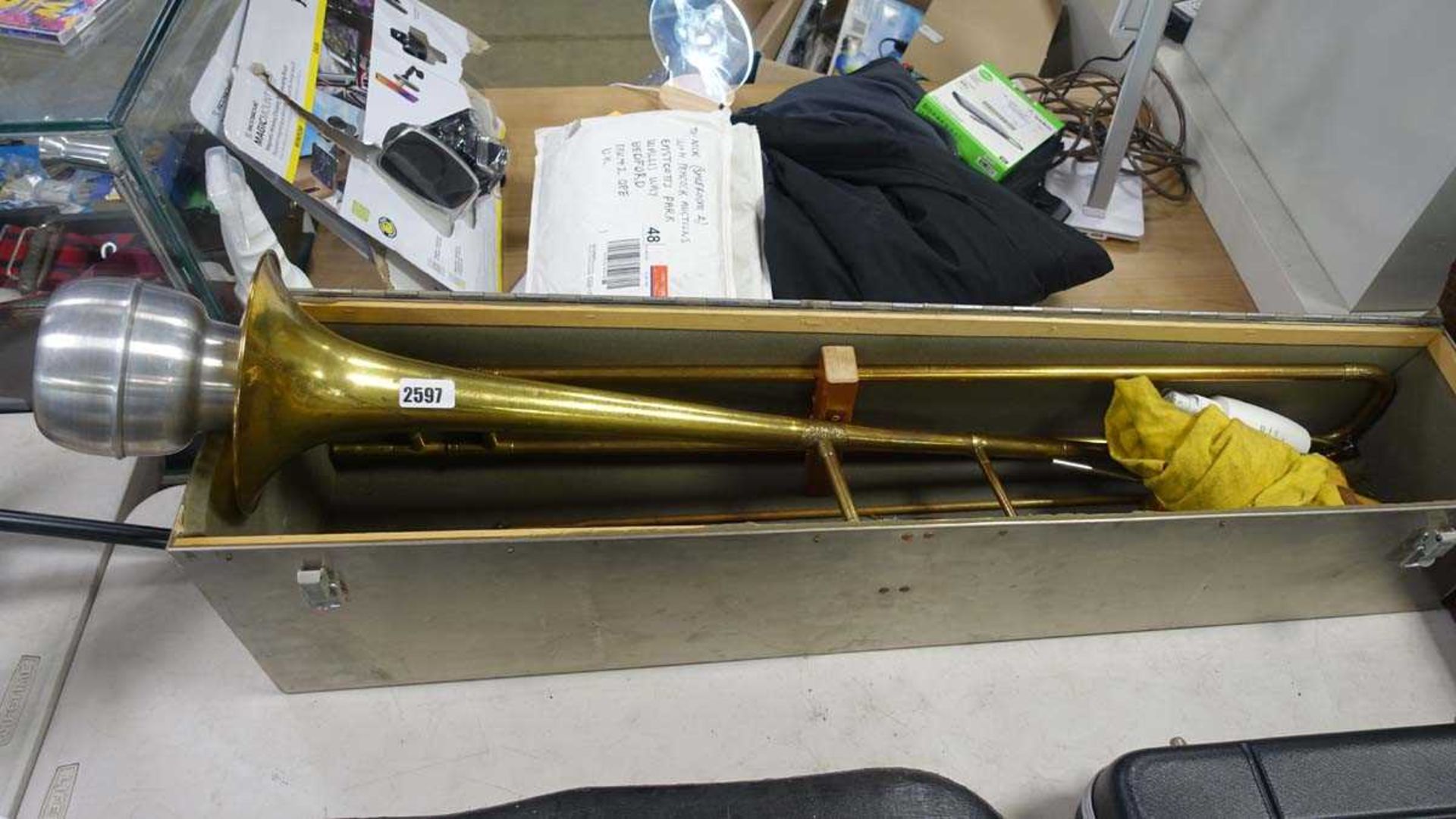 Trombone with silencer and metal case