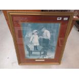 Framed and glazed print of an old man and child