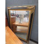 Rectangular bevelled mirror in black and gilt frame