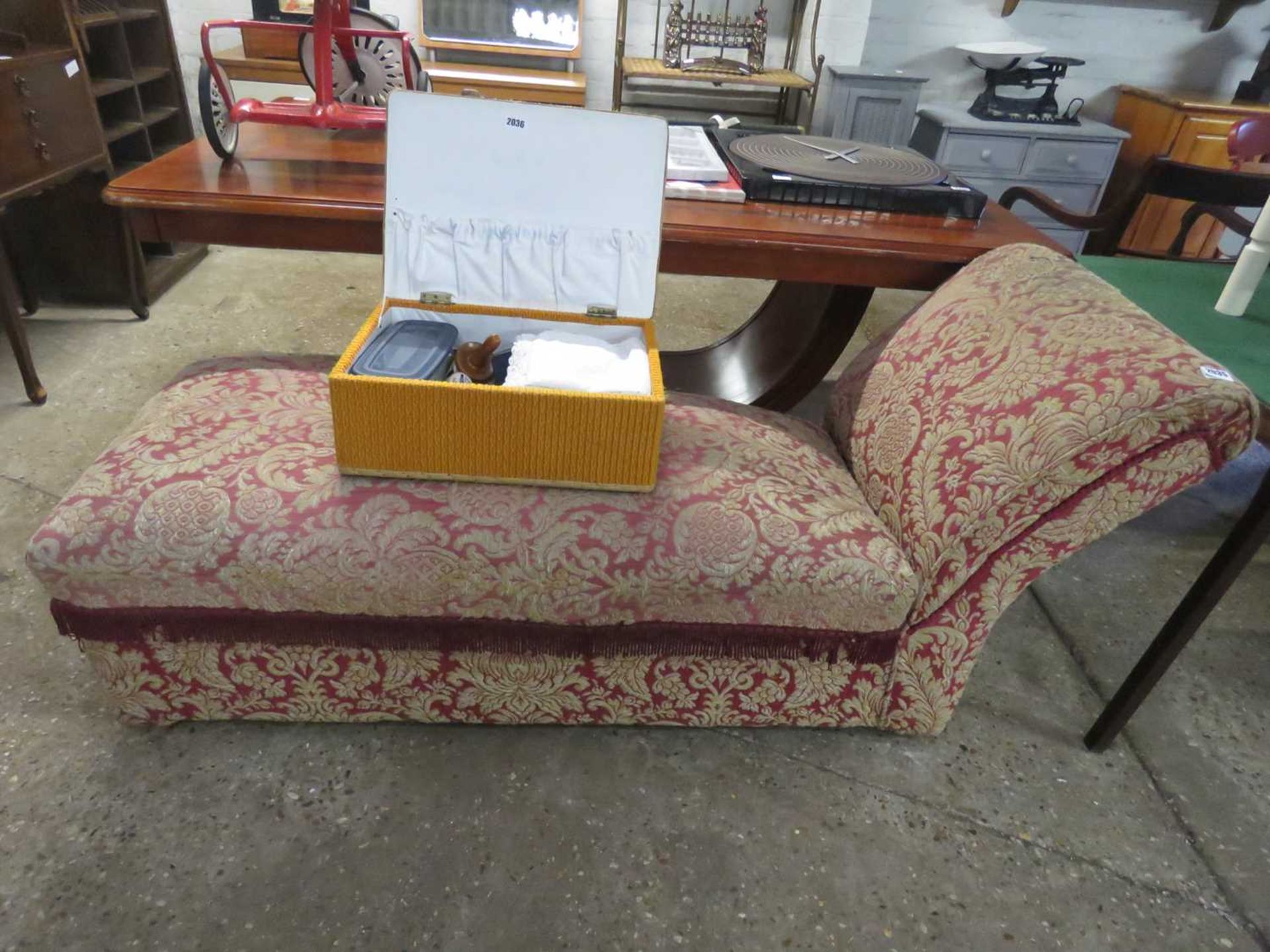 Red and gold floral upholstered chaise longue